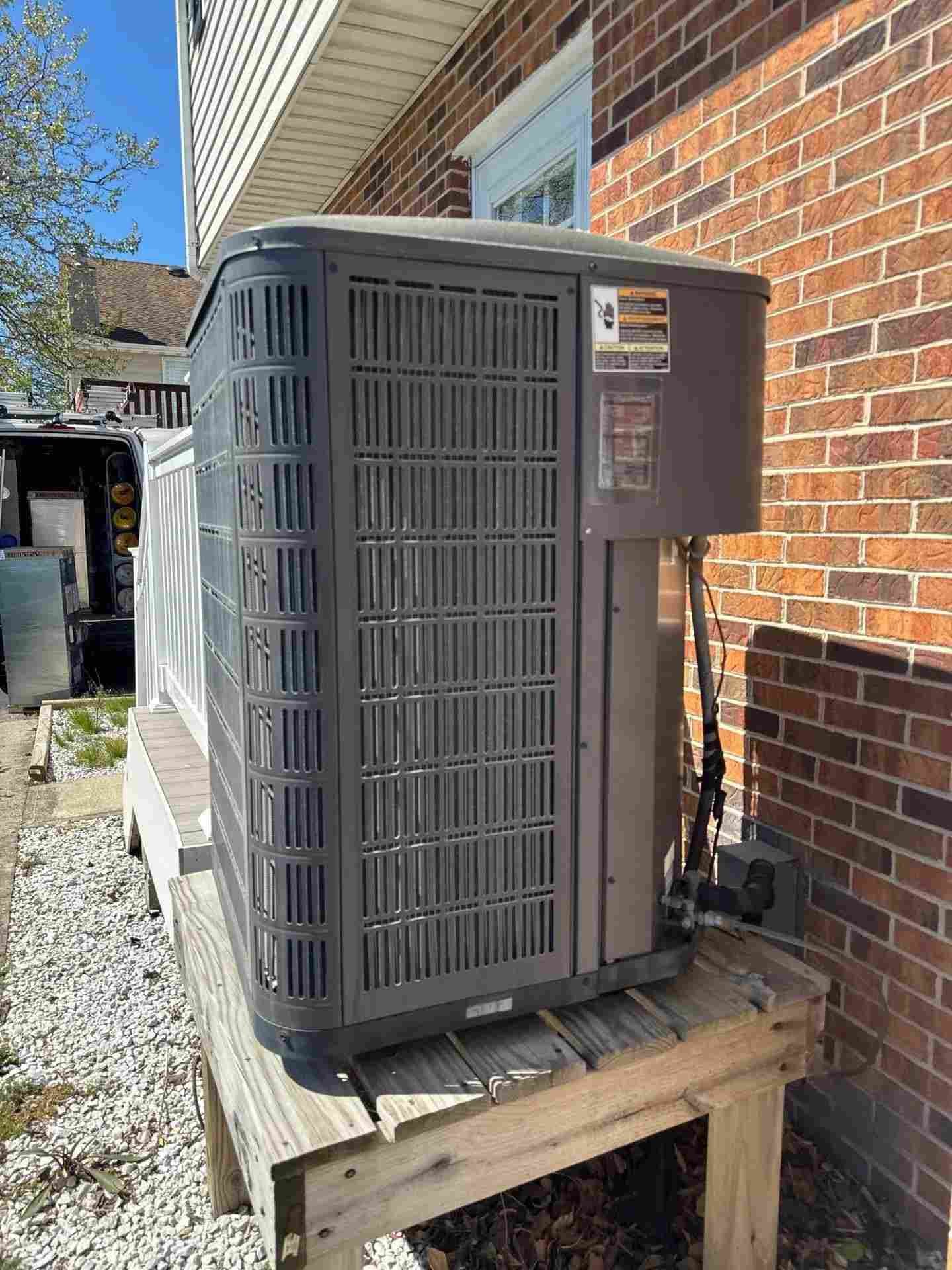 HVAC technician servicing an air conditioner in a Baltimore home