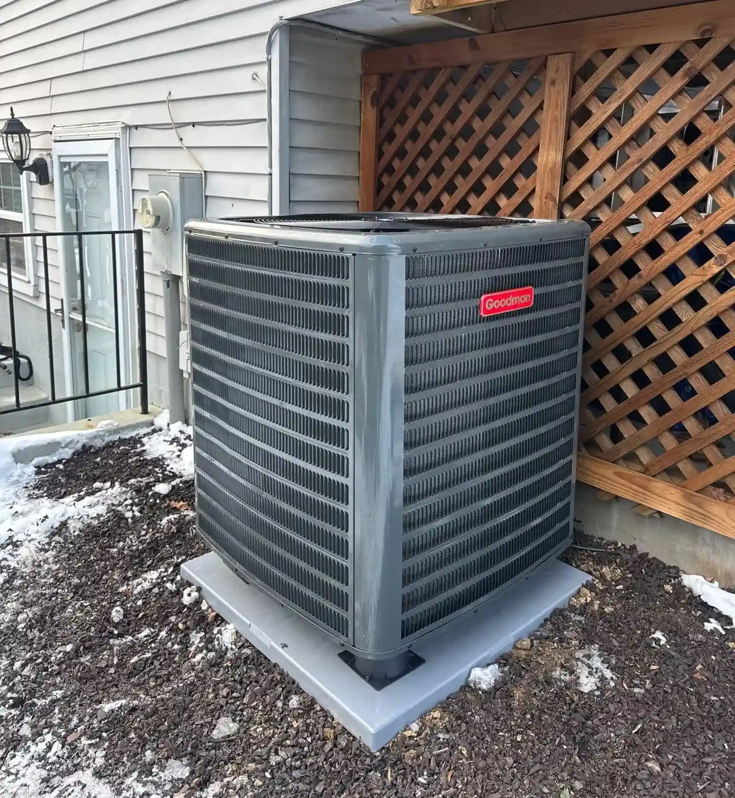 Blog Technician repairing HVAC unit to prevent summer breakdown