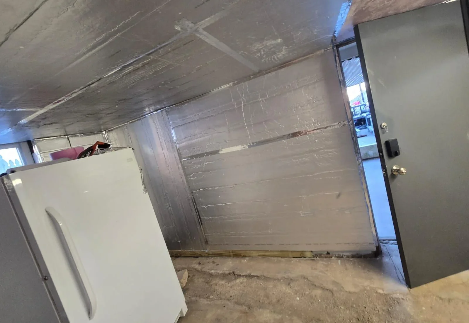 Blog Home insulation being installed in attic to improve summer energy efficiency
